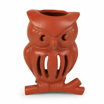 Vibrant red metal owl lantern candle holder with intricate cutwork for festive home decor.