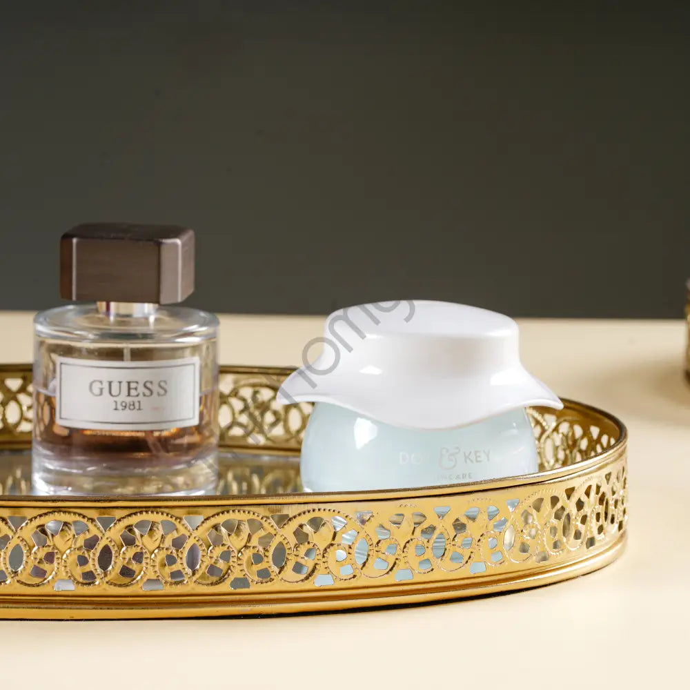 Round gold mirror vanity tray with decorative metal cutwork border for perfume and makeup organization. - 5