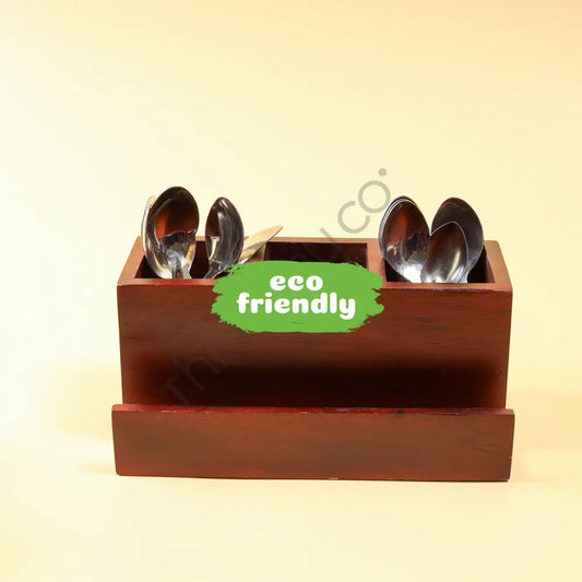 Handcrafted wooden cutlery holder and kitchen utensil organizer with multiple compartments for spoon and fork storage.